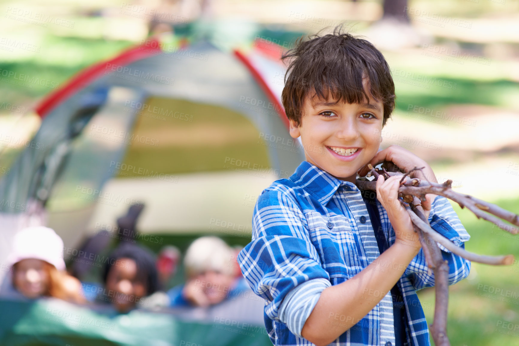 Buy stock photo Wood, camping or portrait of boy in forest for playing, adventure or holiday vacation in park. Relax, collect or happy child with smile or sticks in woods, garden or nature for fun hiking or wellness