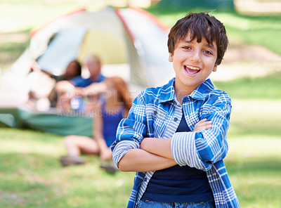 Buy stock photo Kid, portrait and happy on camping adventure in outdoors, smiling and relaxing on vacation or holiday. Male person, child and face or confident in park, childhood and summer or arms crossed in nature