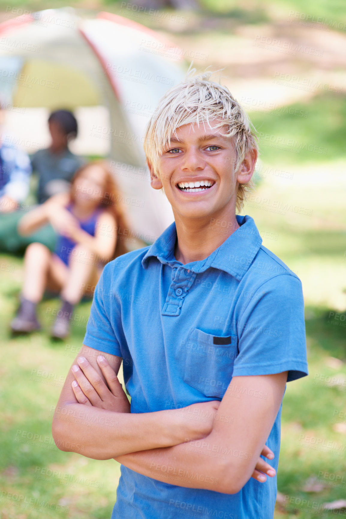 Buy stock photo Boy, kid with smile and arms crossed at summer camp and nature with fun outdoor for youth. Child at campsite in forest, adventure and vacation, childhood and recreation with happiness in portrait

