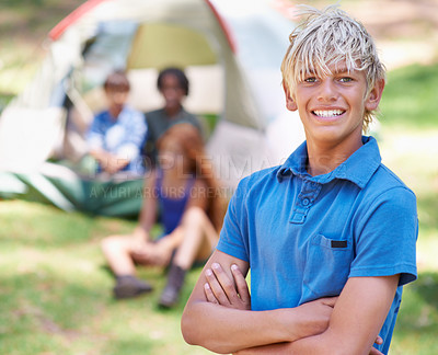 Buy stock photo Boy, child with smile and arms crossed at summer camp and nature with fun outdoor for youth. Kid at campsite in forest, adventure and vacation, childhood and recreation with happiness in portrait