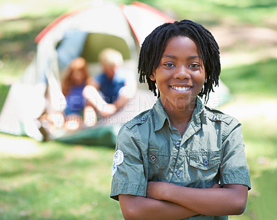 Buy stock photo Child, portrait and smile on adventure at campground, happy and relaxing on vacation or holiday. Black male person, smiling and face or confident in park, childhood and summer or cheerful in nature