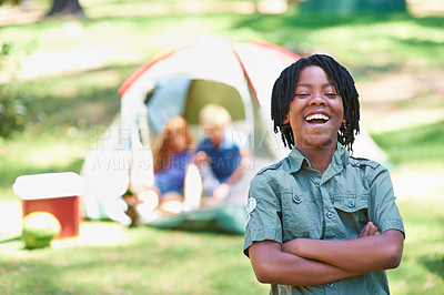 Buy stock photo Boy, kid laughing with arms crossed at summer camp and nature with fun outdoor for youth. African child at campsite in park, adventure and vacation, childhood with recreation and happy in portrait