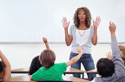 Buy stock photo Black woman, teacher and children with question in classroom for education, learning or answer. African female person, lecturer or educator with kids and hands raised for interaction in presentation