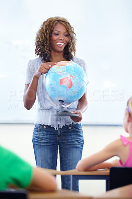 Buy stock photo Globe, woman teacher and classroom for geography education, world learning and earth knowledge in classroom. Happy african person with school children for teaching global information, planet and map 