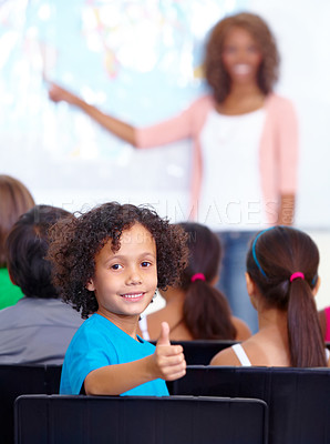 Buy stock photo Happy student, portrait and kid with thumbs up in class for winning or success together at school. Young male person, child or boy smile with like emoji, yes sign or OK for education in classroom