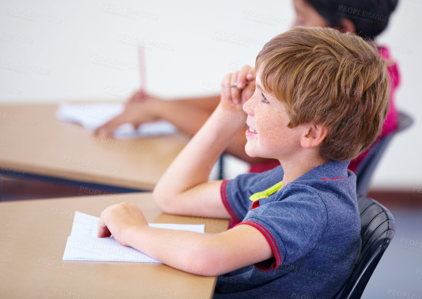 Buy stock photo Learning, happy child or student in classroom for knowledge, education or development for growth. School, smart boy or clever male kid with book, smile or pride for studying, focus or future at desk