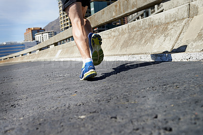 Buy stock photo Cropped image of a runners legs as he runs onwards