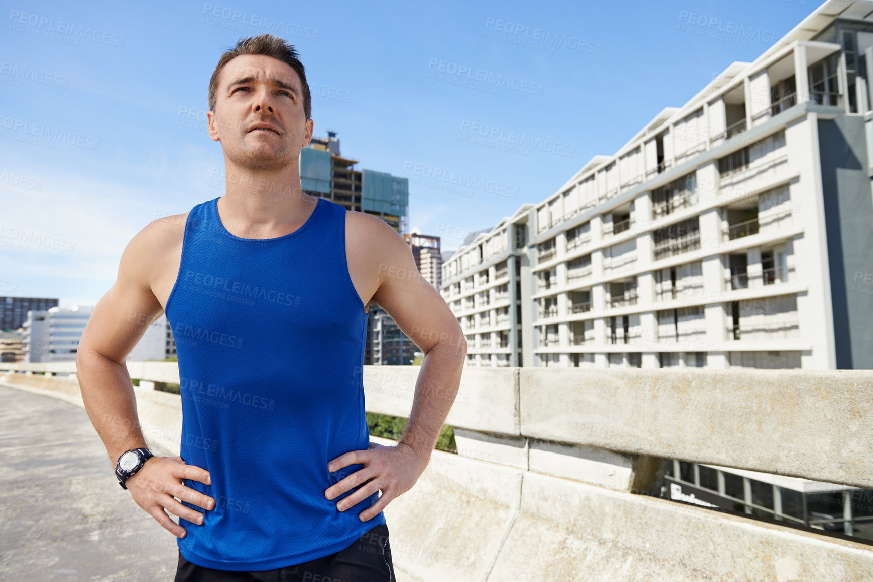 Buy stock photo Man, fitness and break on road in city for workout, exercise or outdoor cardio by buildings. Active male person, athlete or runner in training or practice for health and wellness in an urban town