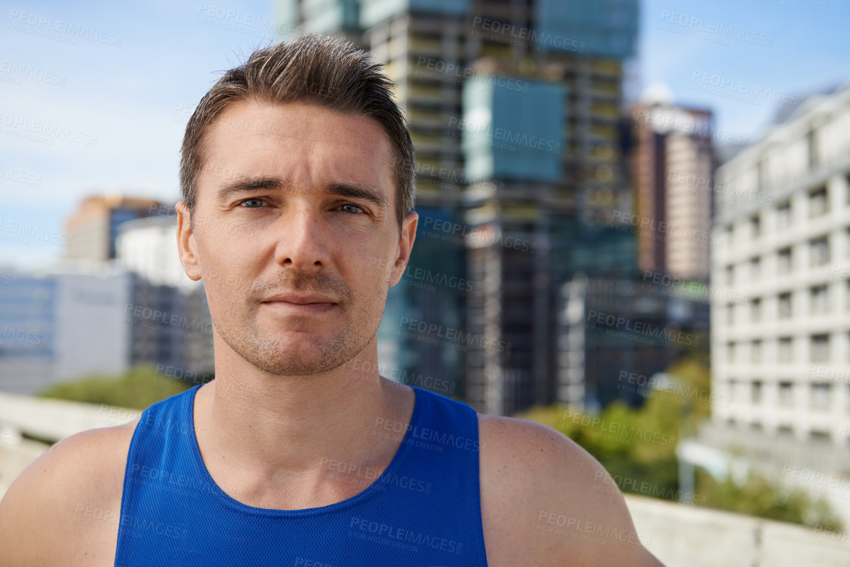 Buy stock photo Man, portrait and fitness in city for running, sports or outdoor workout, exercise or training. Face of active male person or athlete ready for cardio, health and wellness on road in an urban town