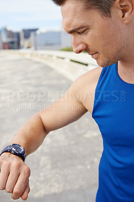Buy stock photo Man, fitness and looking at watch in city for workout, exercise or monitoring outdoor performance. Closeup of male person or athlete checking wristwatch for training or heart rate in an urban town