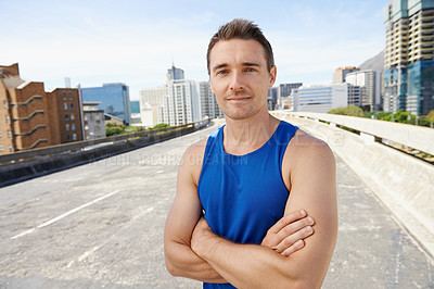 Buy stock photo Man, arms crossed in city and exercise outdoor with workout, training and athlete in portrait for sports. Confidence, face and fitness on urban bridge, health and wellness with sportswear in Chicago