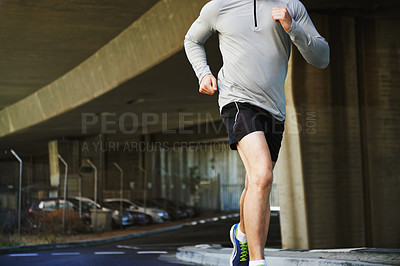 Buy stock photo Cropped image of a young man going for a run