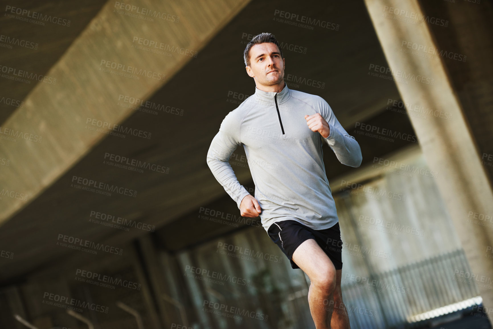 Buy stock photo Man, exercise and fitness on road in outdoors, cardio and run or training for marathon. Male person, athlete and workout by city background, sportswear and performance challenge by bridge on street