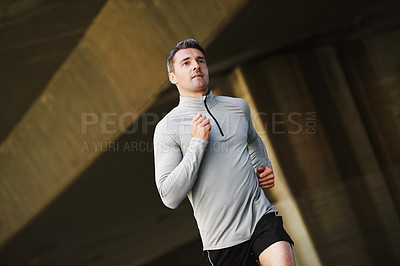 Buy stock photo Man, runner and wellness on street in outdoors, cardio and exercise or training for marathon. Male person, athlete and workout by city background, sportswear and performance challenge by bridge