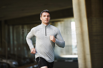 Buy stock photo Man, runner and training on street in outdoor, cardio and exercise or prepare for marathon. Male person, athlete and workout by city background, sportswear and performance challenge by bridge on road