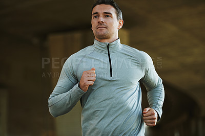 Buy stock photo Cropped image of a mature man out on a brisk run