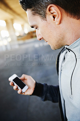 Buy stock photo Man, runner and checking progress on phone, screen and exercise or training for marathon. Male person, athlete and workout by city background, mobile app and performance challenge or timer in outdoor