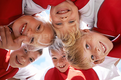 Buy stock photo Children, portrait and soccer team huddle in outdoors, happy and collaboration or support. People, kids and boys together for match and partnership, smiling and solidarity in circle by sky background