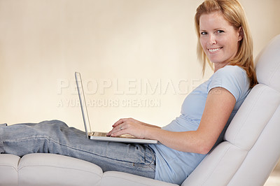 Buy stock photo Woman, remote work from home and laptop on chair, portrait and type email for job, copywriter or creative. Freelancer, technology and working for startup publishing company, internet and online
