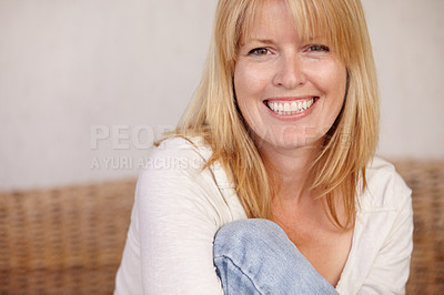 Buy stock photo A beautiful mature woman smiling in her home