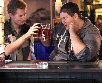 Buy stock photo Friends, beer and cheers with man at pub for conversation, social and alcohol. Nightlife, toast and restaurant with people  talking at table in bar for discussion, celebration and weekend gathering
