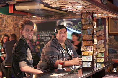 Buy stock photo Two friends drinking at the local bar