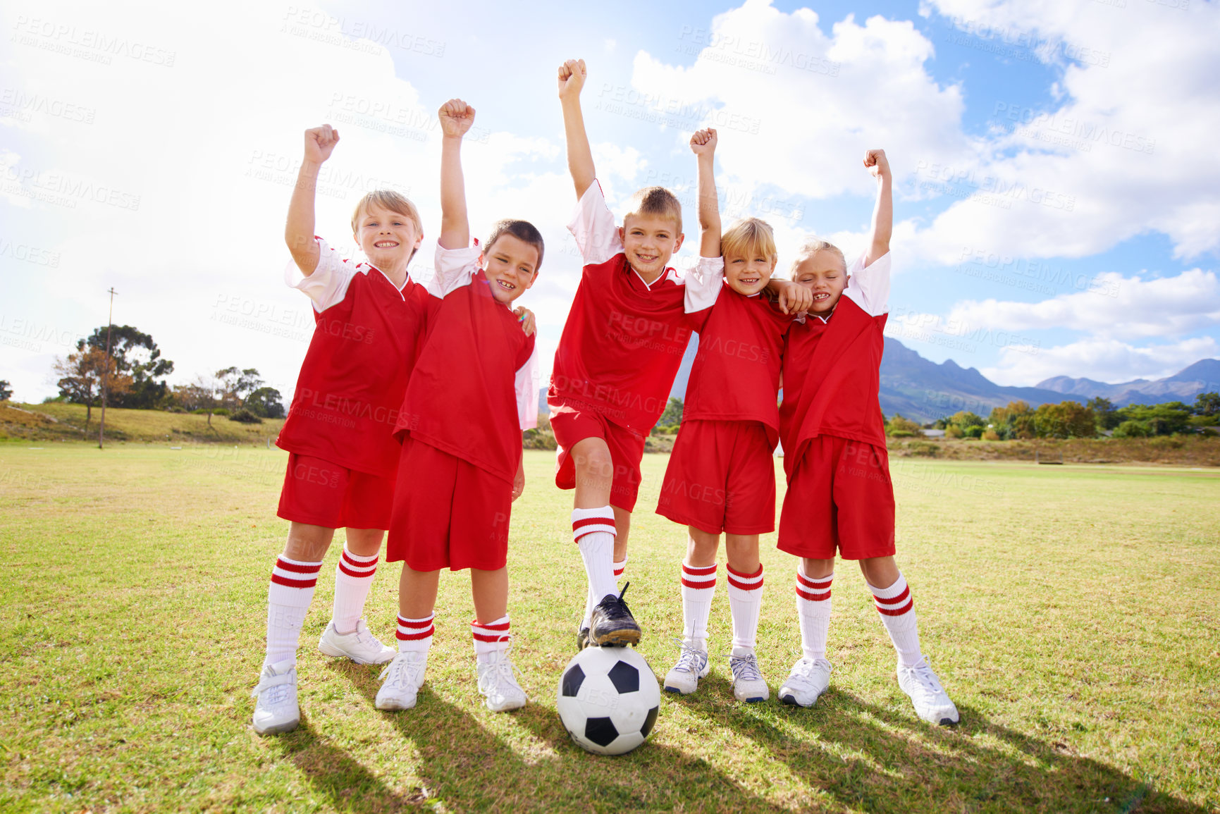 Buy stock photo Children, soccer team and celebration for winning or happy, success and victory in outdoors. People, kids and fist pump for achievement, collaboration and partnership or teamwork on field or sport