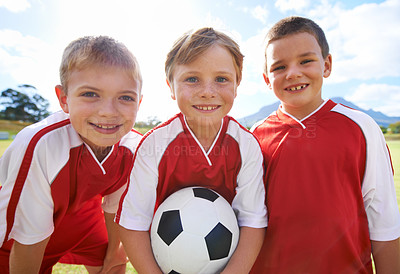 Buy stock photo Children, group portrait and happy soccer team, field and collaboration or support. People, kids and ready for match and partnership or teamwork, smiling and solidarity or energy for game or match