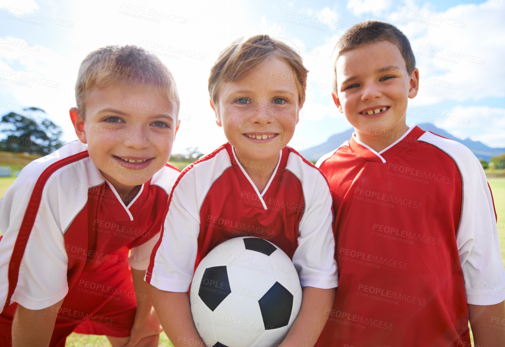 Buy stock photo Children, group portrait and happy soccer team, field and collaboration or support. People, kids and ready for match and partnership or teamwork, smiling and solidarity or energy for game or match