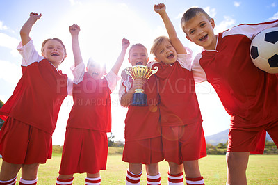 Buy stock photo Celebration, soccer team and children with cup, young and smile with victory, support or proud. Achievement, sports and friendship, together and happy for win, ready for game or physical activity
