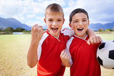 Buy stock photo Happy boy, portrait and friends fist pump for soccer, winning or celebration on outdoor field. Excited male person, children or kids smile for football, victory or friendly game together in nature