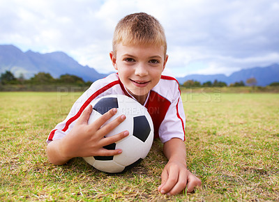 Buy stock photo Boy, player and soccer ball with portrait, smile and young for game, field and child. Outdoor, workout and sport for kid, happy and athlete for match, training and exercise on football pitch