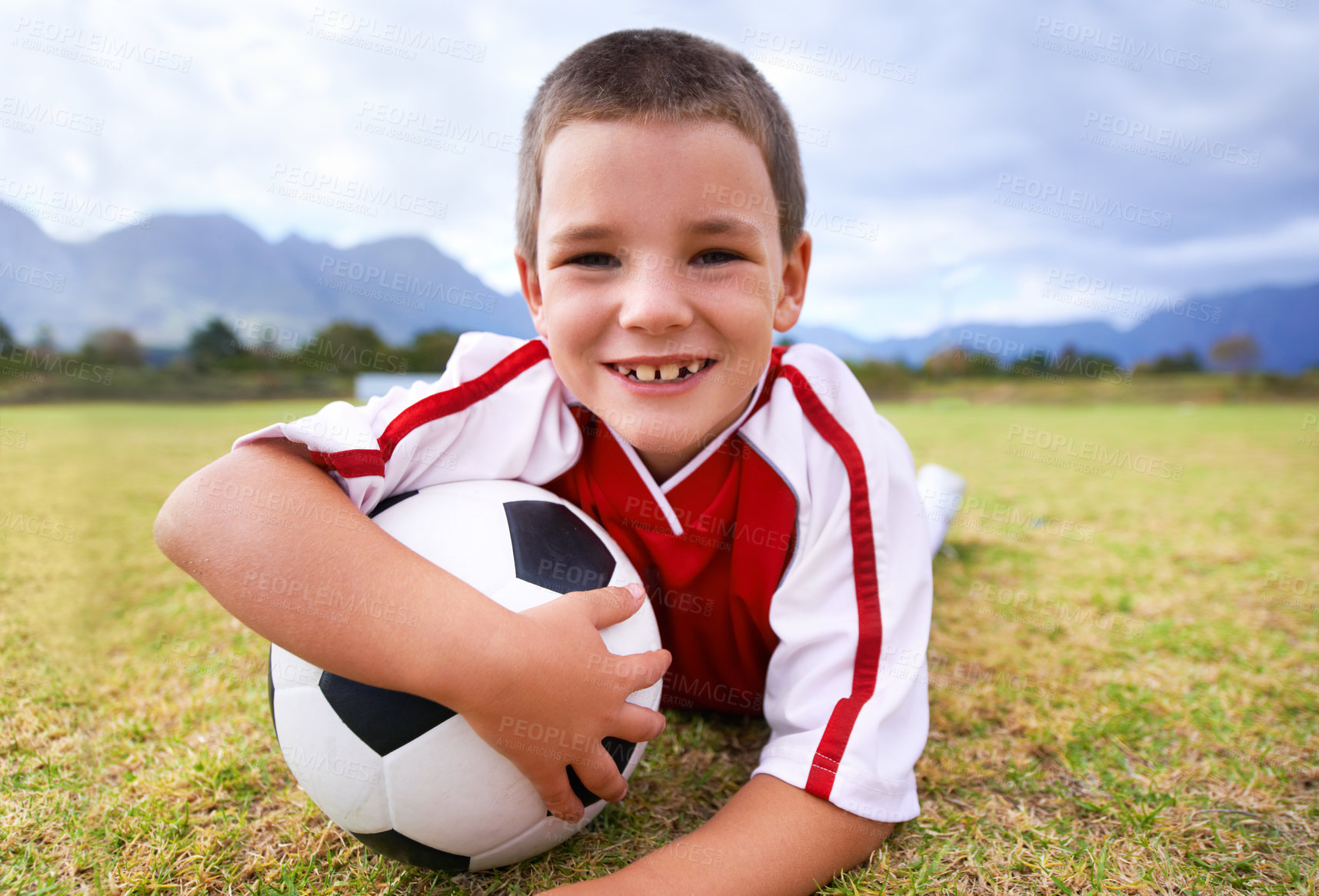 Buy stock photo Portrait, soccer player and ball with child, smile and ready for game, field and kid. Fitness, playful and sport for childhood, happy and athlete for match, alone and outside on football pitch