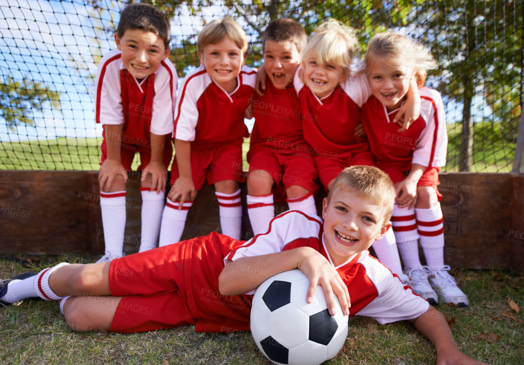 Buy stock photo Children, soccer team and portrait with ball, boys and girls with players, support or solidarity. Energy, sports and friendship, together and happy for win, ready for game or physical activity 
