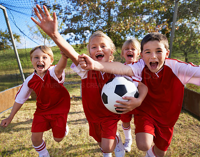 Buy stock photo Shot of a children's soccer team