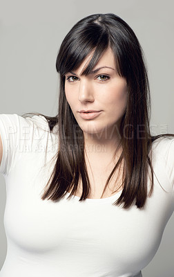 Buy stock photo Studio shot of a plus-size model posing for the camera