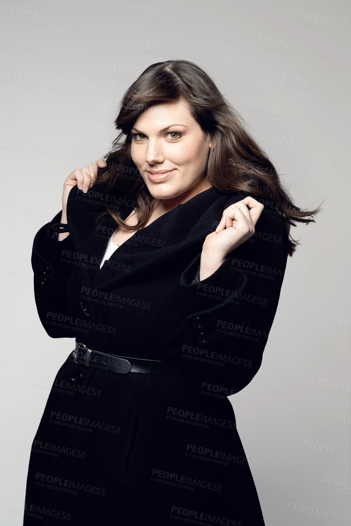 Buy stock photo Studio shot of a plus-size model posing for the camera