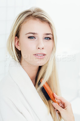 Buy stock photo Attractive woman, portrait and hair brush for beauty, cosmetics or style in bathroom treatment at home. Face of young blonde female person brushing in haircare for knots or split ends at house