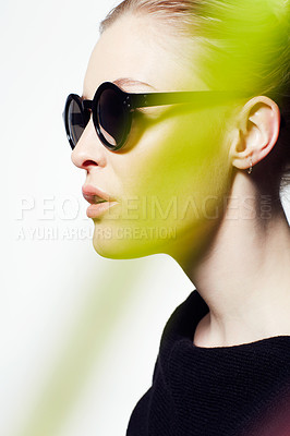 Buy stock photo Woman, profile with sunglasses for fashion and light streak, cosmetics or makeup, creativity and neon glow on white background. Art deco, beauty and bright color in studio, style and dark eyewear 
