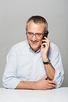 Buy stock photo Senior business man, phone call and studio with happiness, smile and listening by gray background. Elderly guy, happy and excited face for contact, chat and smartphone for communication by backdrop