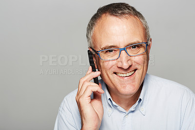 Buy stock photo Phone call, portrait and senior businessman in a studio with pride for legal corporate career. Glasses, smile and professional elderly male lawyer on mobile discussion isolated by gray background.