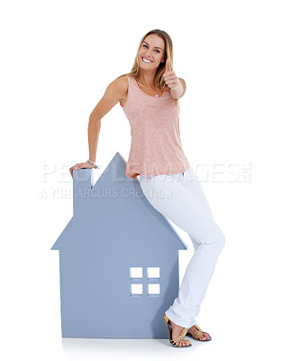 Buy stock photo Woman, thumbs up and home board portrait for real estate, property investment and house vision in studio. Realtor winner, home loan approval and and property management agreement in white background
