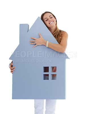 Buy stock photo Woman, studio and house cutout with smile, success and hug for real estate by white background. Isolated model, cardboard home poster and happiness for property, investment and idea of new home