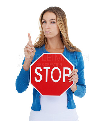 Buy stock photo Woman, studio and holding stop sign with pointing for serious, assertive or angry face by white background. Model activism portrait, stop and equality for transparency while isolated for woman rights