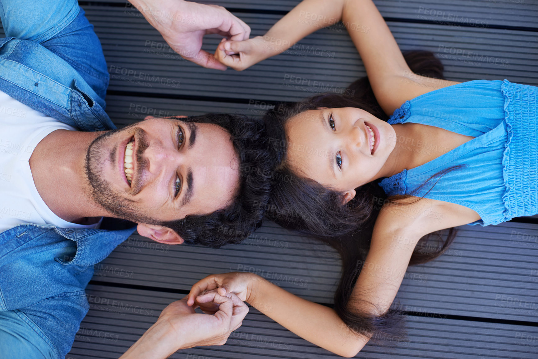 Buy stock photo Holding hands, floor portrait and relax happy family, children and dad smile for Fathers day, outdoor peace and connection. Solidarity, closeup and young kid, girl or youth child bonding with parent
