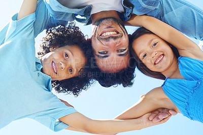 Buy stock photo Portrait, blue sky and happy family hug, father and children bonding, support and solidarity circle for care, unity or love. Group face, freedom and below view of kids, parent or people together
