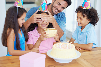 Buy stock photo Birthday cake, child and gift with covered eyes, surprise and happy family for celebration, siblings and home. Singing, smile and love with presents, together and parent for childhood, party or kid
