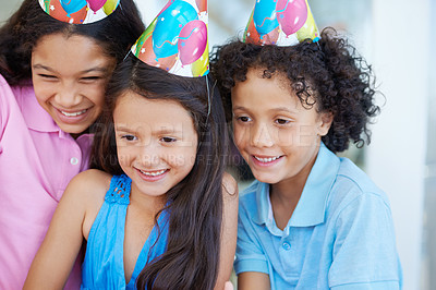 Buy stock photo Happy, birthday party and children with hats at their home for celebration and bonding together. Smile, excited and sweet young kids at event with friendship, youth and childhood at modern house.