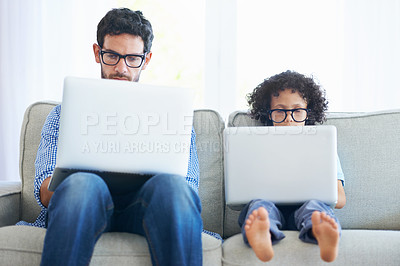 Buy stock photo Father, child and laptop working on sofa in living room together with technology and glasses at home. Dad, kid or little boy pretend to work in remote work on lounge couch with computer indoors