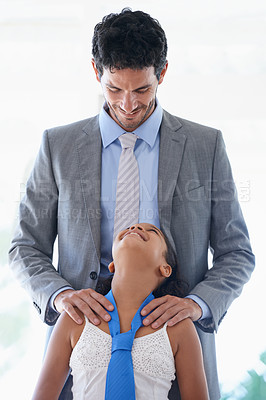 Buy stock photo Smile, tie and father bonding with child in living room of family home together for love. Happy, care and dad talking or speaking to girl kid with youth for conversation or communication at house.